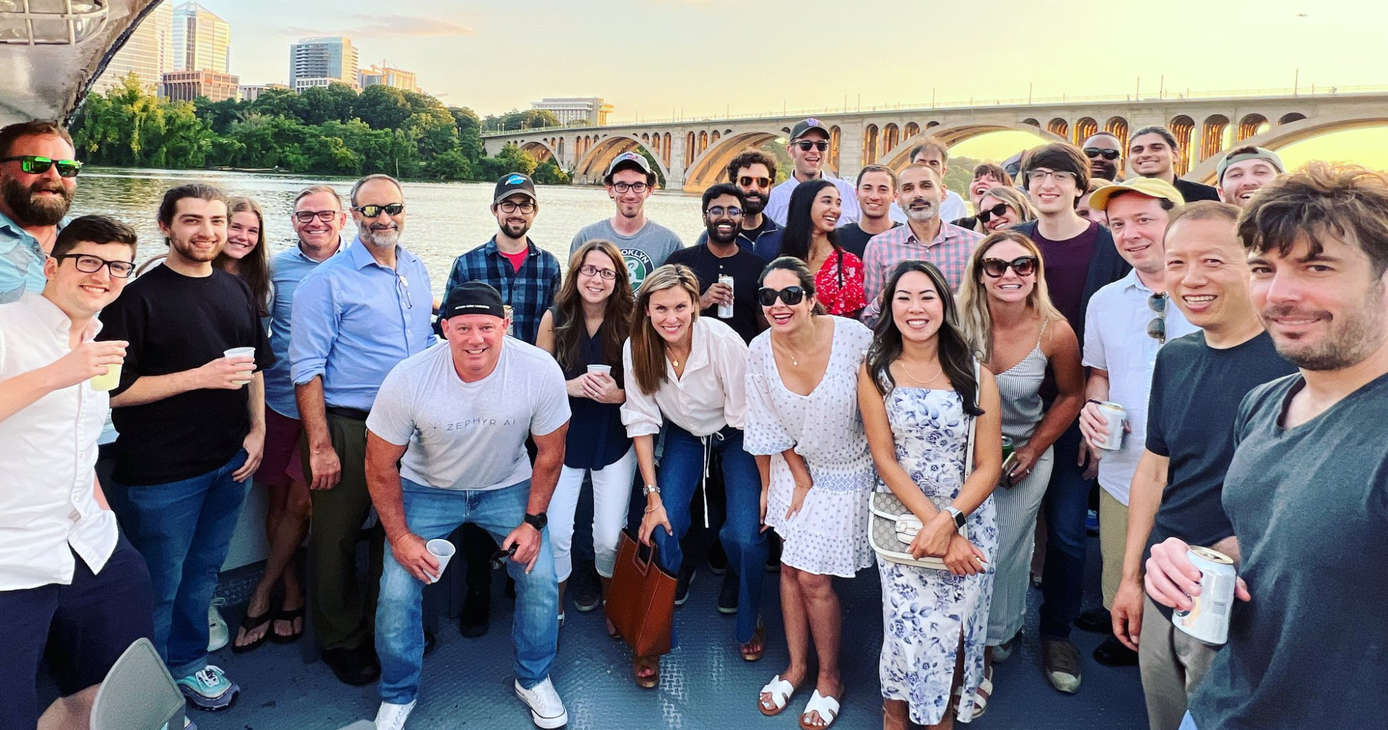 A photograph of the Zephyr AI team on a cruise.